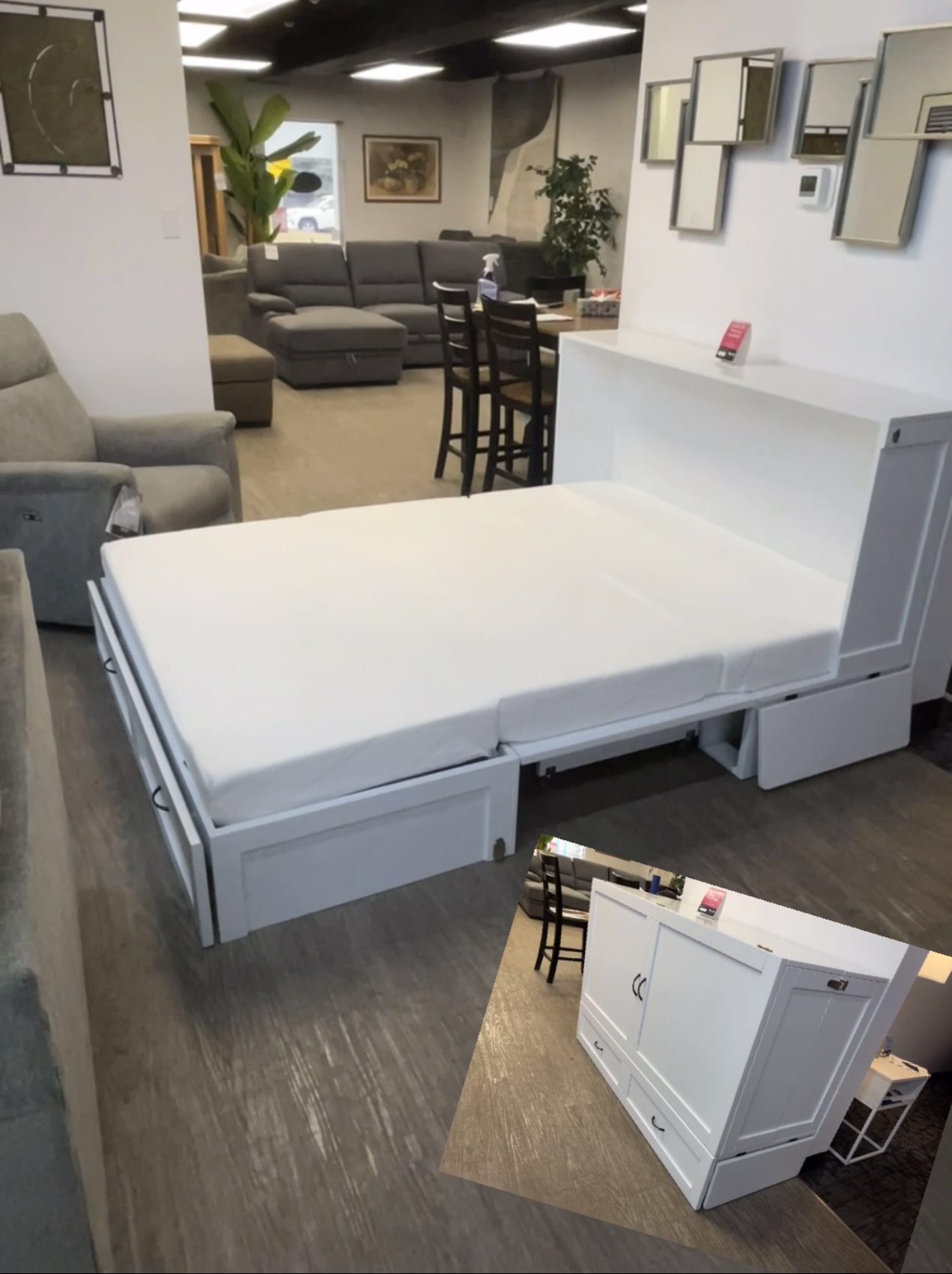 The Olivia Queen Cabinet Bed in a closed position, appearing as a high-end solid wood credenza at Forward Furniture Edmonton.