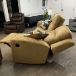 Ashley Kanlow dual-sided manual reclining sofa showing the footrests fully extended. #forwardfurnitureedmonton #colinthefurniturefella