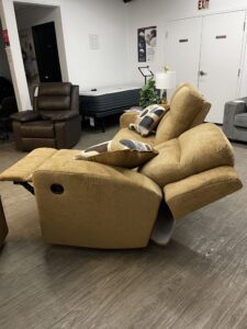 Ashley Kanlow dual-sided manual reclining sofa showing the footrests fully extended. #forwardfurnitureedmonton #colinthefurniturefella